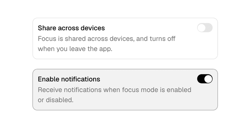 Two shadcn/ui settings cards, Share across devices switched off and Enable notifications switched on, each with a bold label and a sentence of helper text